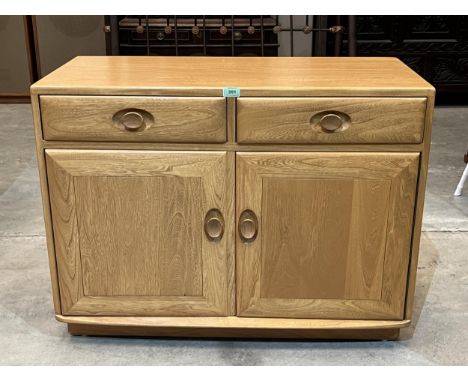 An Ercol Windsor side cabinet. 36" wide.