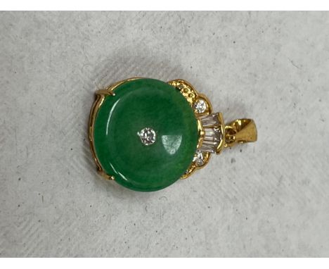 A jade and white stone pendant.