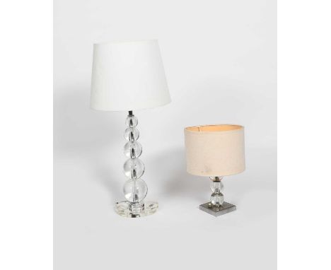 An Adnet table lamp, five graduated clear glass spheres on circular base, and another smaller on metal base, with modern shad