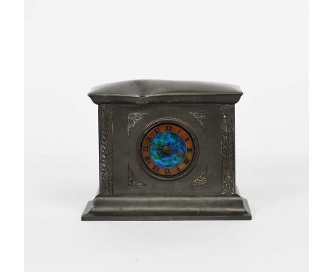 A Liberty & Co Tudric pewter mantel clock, model no.01155, rectangular section, cast in low relief with foliate panels, the c