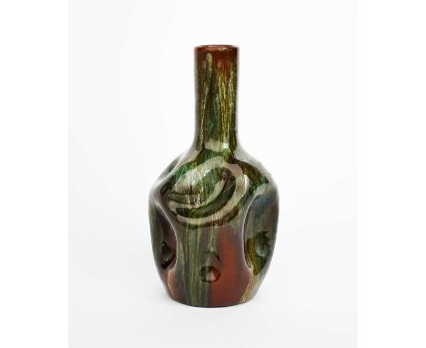 A Linthorpe Pottery vase designed by Dr Christopher Dresser, shape no.24, shouldered dimpled body with tall cylindrical neck,