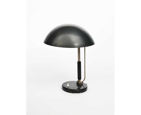 A Bauhaus style enamelled metal table lamp designed by Karl Trabert, on circular base, enamelled black, unsigned, 44cm. high