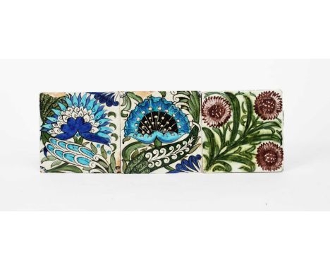 A pair of William De Morgan Merton Abbey Persian Mongolian tiles, each painted with a stylised lotus flower in blue, turquois