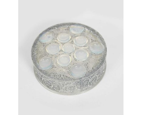 'Roger' a Lalique opalescent glass box and cover designed by Rene Lalique, circular form, cast R Lalique mark to side of cove