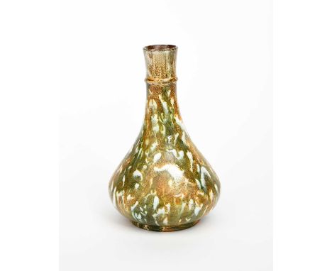 A Linthorpe Pottery bottle vase designed by Dr Christopher Dresser, ovoid with tapering cylindrical neck, covered in a streak