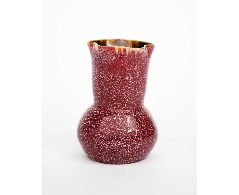 A Linthorpe Pottery vase designed by Dr Christopher Dresser, model no.210, ovoid with flaring neck and fluted rim, covered in