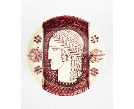 An Art Deco pottery charger, painted with a Classical portrait, in red on a cream ground, printed EWG 34 to base, 36cm. diam.