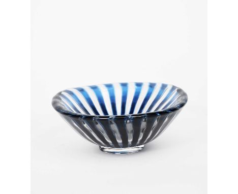 An Orrefors glass Ariel bowl by Edvin Ohrstrom, footed form, blue glass with pulled bubble radiating panels, cased in clear, 