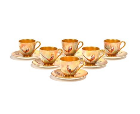 A cased set of six Royal Worcester coffee cups and saucers by Walter Sedgley, circa 1926, painted with golden pheasants, sign