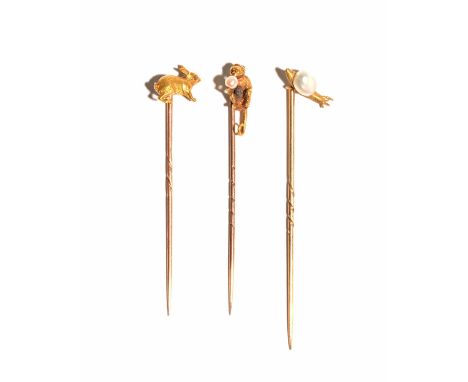 A gold and cultured pearl stick pin, modelled as a monkey, detailed 18, a cultured pearl stick pin, modelled as a snail and a