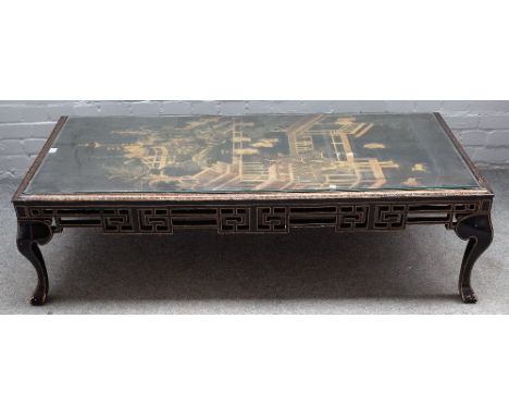 A black and gilt Japanned low table, the top inset with 19th century Chinese panel, on square cabriole supports, 93cm wide x 