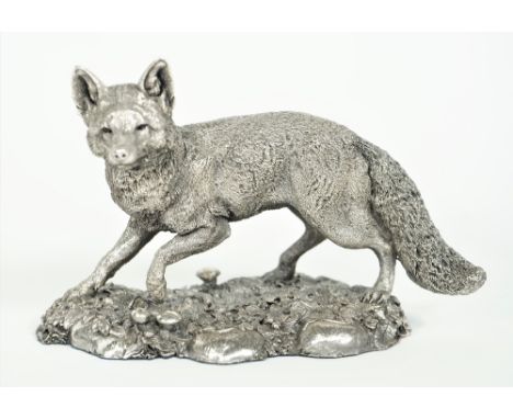 A silver model of a standing fox, raised on a shaped oval rustic base (detailed filled), Birmingham 1996, length 12.5cm x hei