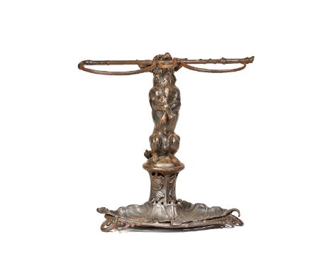 A Coalbrookdale cast iron stick stand, late 19th century, modelled as a dog on hind legs with a riding crop in his mouth, the