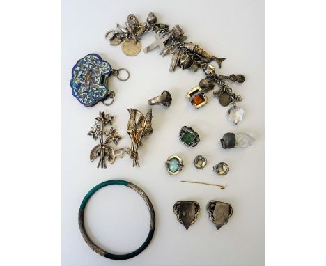 A group of jewellery, comprising; a charm bracelet, fitted with a variety of mostly silver charms, four gem set rings, two br