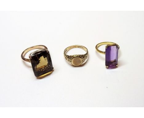 A gold ring, claw set, with a rectangular cut smoky quartz, ring size O and a half, a gold ring, claw set with a rectangular 