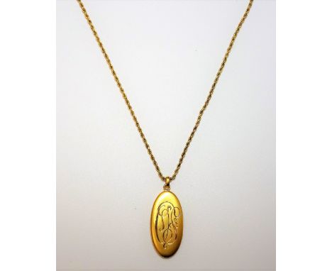 A gold ropetwist link long guard chain, detailed 9 CT, with a boltring clasp, detailed 9 CT and a gold oval pendant locket, m