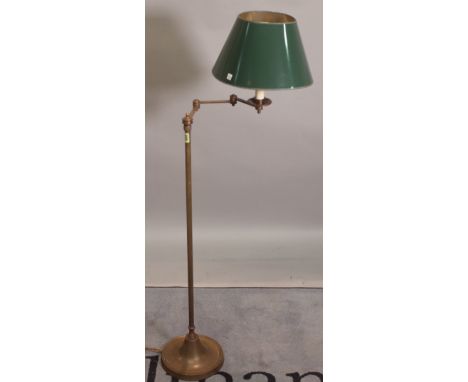 An early 20th century brass angle poise adjustable standard lamp, 127cm high. 