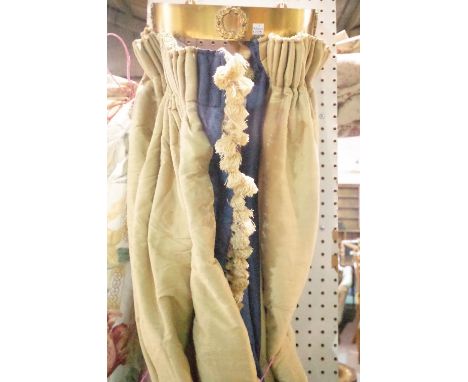 A 20th century brass bed corona with lined blue silk curtains, 245cm high.