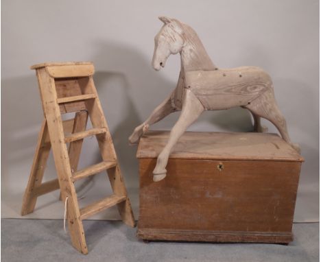 An early 20th century grey painted rocking horse, 96cm wide x 47cm high, a pine step ladder, 81cm high, a early 20th century 