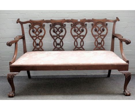 A 19th Chippendale revival carved mahogany quadruple chair back open arm sofa, on claw and ball feet, 171cm wide x 100cm high