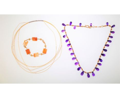 A fringe necklace, formed as a row of graduated amethyst briolette drops, a wirework collar necklace and a faceted rectangula