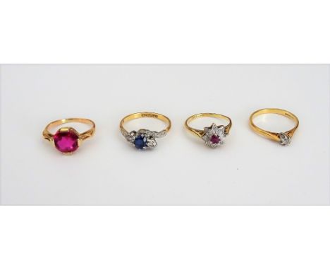 A gold and platinum, ruby and diamond ring, designed as a star, detailed 18 CT &amp; PT, a gold and platinum, sapphire and di