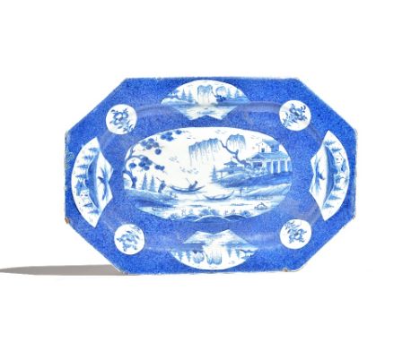 A large Bow octagonal blue and white dish, circa 1765, painted with a central chinoiserie landscape panel with a figure in a 