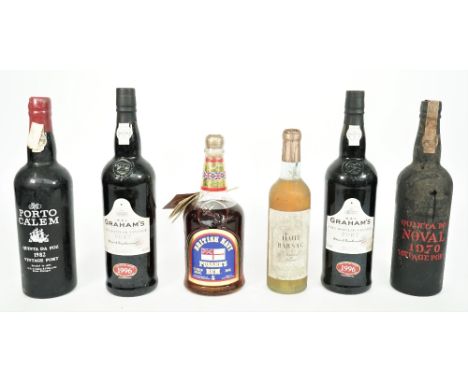 One bottle of Britsh Navy Pussers rum, circa. 1980, one half bottle Haut Barsac, two 1996 Grahams L.B.V port, 1982 Porto Cale