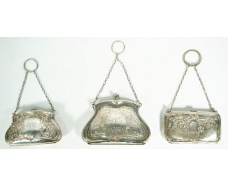 Three lady's silver purses, each having engraved decoration, fitted with a carrying chain and a suspension ring, Birmingham 1