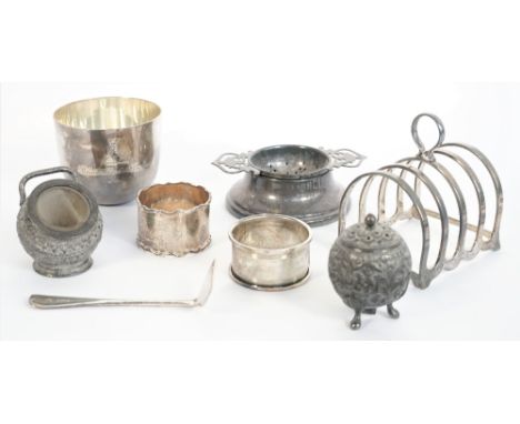 Silver, comprising; a five bar toastrack, with a loop shaped handle, Birmingham 1952, a tumbler cup, London 1929, a twin hand
