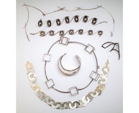 A group of studio jewellery, mostly silver, comprising; two bracelets, a bangle detailed 925 Jackie Cohen, a collar necklace,