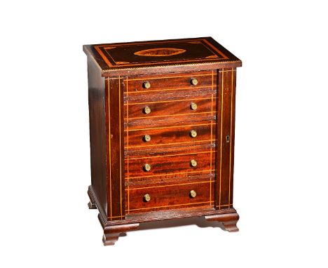 An Edwardian inlaid mahogany table top Wellington chest, the locking bar enclosing five long graduated drawers on open bracke