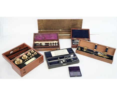 A mahogany cased drawing instrument set, late 19th century, enclosing a folding ivory rule and a flat rule, 19cm wide, a Syke