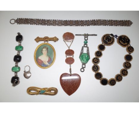 A marcasite and moulded glass imitating jade brooch, a brooch mounted oval portrait miniature of a lady, a brooch of serpenti