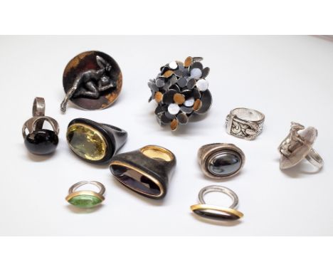 A Scottish silver and gilt ring, of multiple circular abstract design, a dark smoky quartz solitaire ring, detailed Silver, a