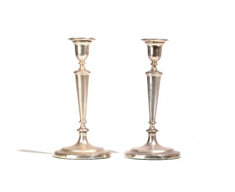 A pair of George III silver table candlesticks, each with a tapered stem, raised on a circular foot, Sheffield 1792, height 2