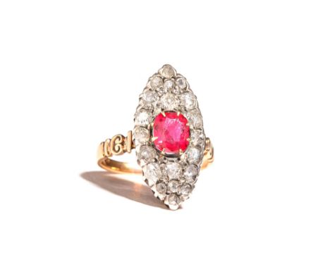 A gold and silver set, diamond and synthetic ruby, marquise shaped cluster ring, claw set with the oval cut synthetic ruby to