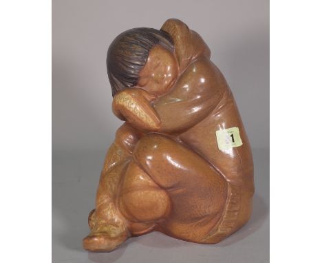 A Lladro matte glaze figure of a sleeping Eskimo, blue printed mark to base, 25cm high. 