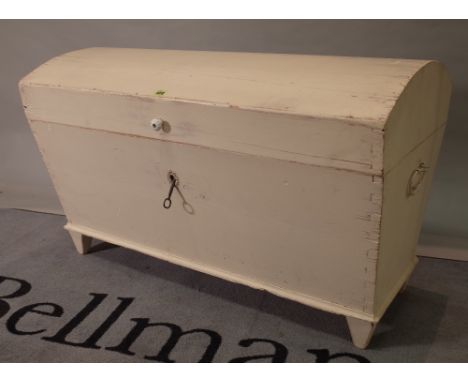 An early 20th century white painted pine dome top trunk, 100cm wide x 65cm high. 