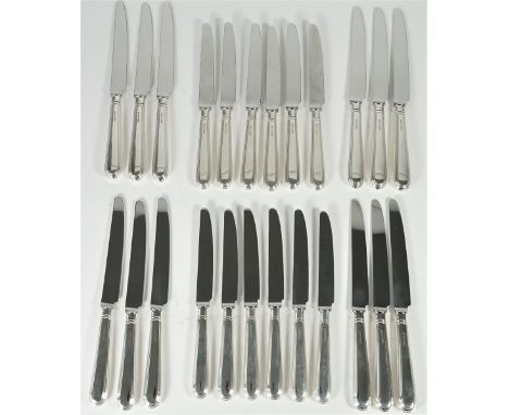 A set of twelve table knives, having loaded silver handles and steel blades and a matching set of twelve cheese knives, havin