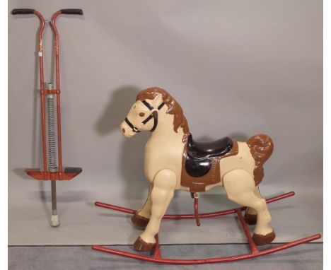 An early 20th century painted rocking horse and a vintage po-go stick, 105cm wide x 68cm high, (2). 