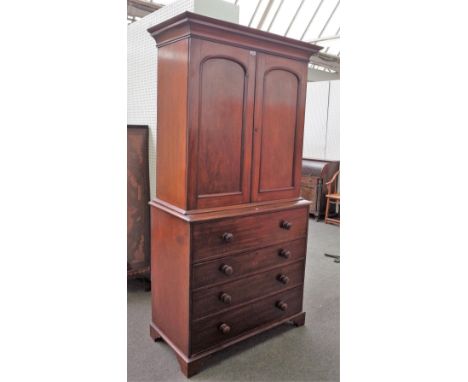 A George III mahogany secretaire cabinet, the pair of arch panel doors, over fitted drawer and three further long drawers, 11