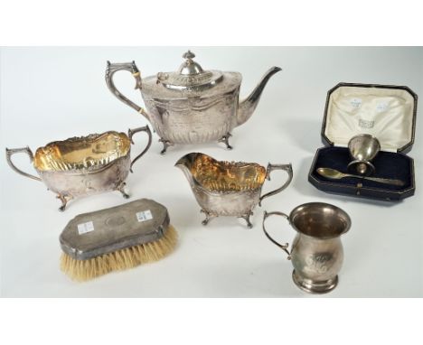 A plated three piece tea set, comprising; a teapot, a twin handled sugar bowl and a milk jug and silver and silver mounted wa