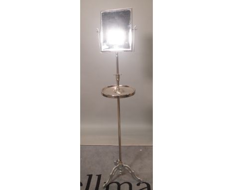 A mid-20th century chrome plated pedestal shaving stand, with swing frame mirror over shelf, on tripod base, 145cm high. 