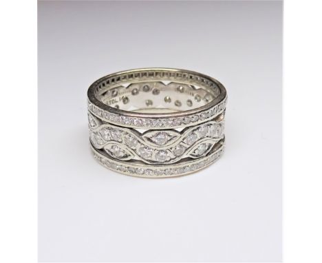 A diamond set wide band full eternity ring, in a pierced openwork design, mounted with circular cut diamonds, detailed Bristo