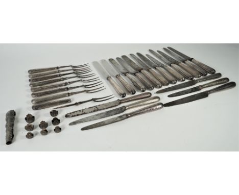 A group of table flatware, comprising; sixteen steel bladed table knives, with loaded silver handles, two re-bladed steel bla