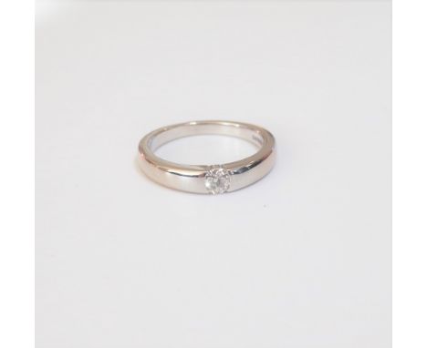 An 18ct white gold ring, mounted with a circular cut diamond, ring size K, gross weight 4.2 gms with a case.