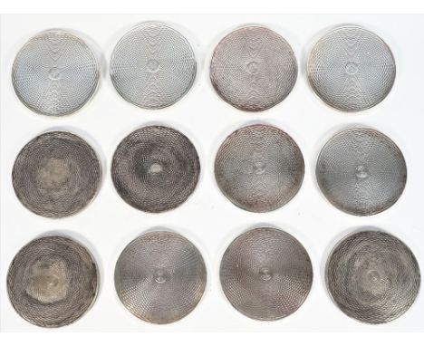 A set of twelve circular coasters, with engine turned decoration (loaded) Birmingham 2000, diameter 8.3cm, (12).