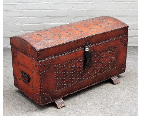 A 20th century Tudor revival studded leather veneered dome topped trunk, on sleigh feet, 91cm high x 52cm high.