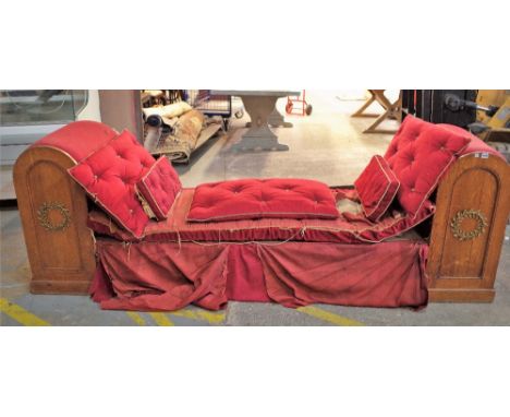 A 19th century Continental oak gilt metal mounted day bed, with domed end supports, 255cm wide x 84cm high.Proveance; Sotheby